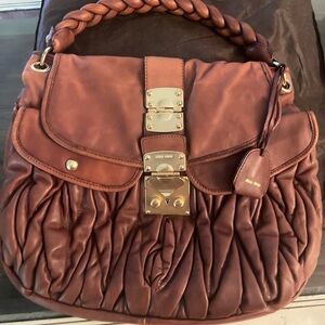 Miu miu brown leather purse. Good used condition. Very clean inside too.